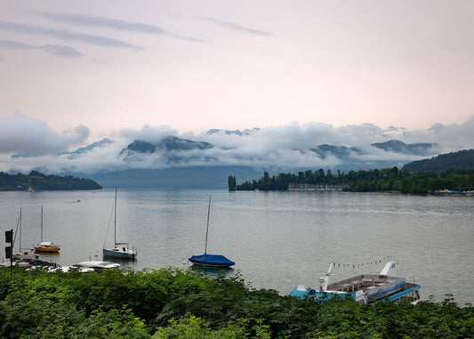 Lake Lucerne Switzerland on a foggy morning before the day begins when the waters are calm and little activity