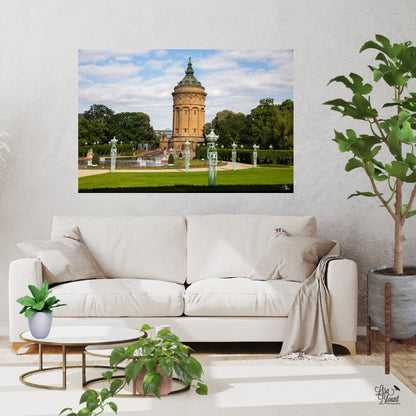 White room with plants featuring a large art of the Mannheim square and water tower hanging above the comfy couch