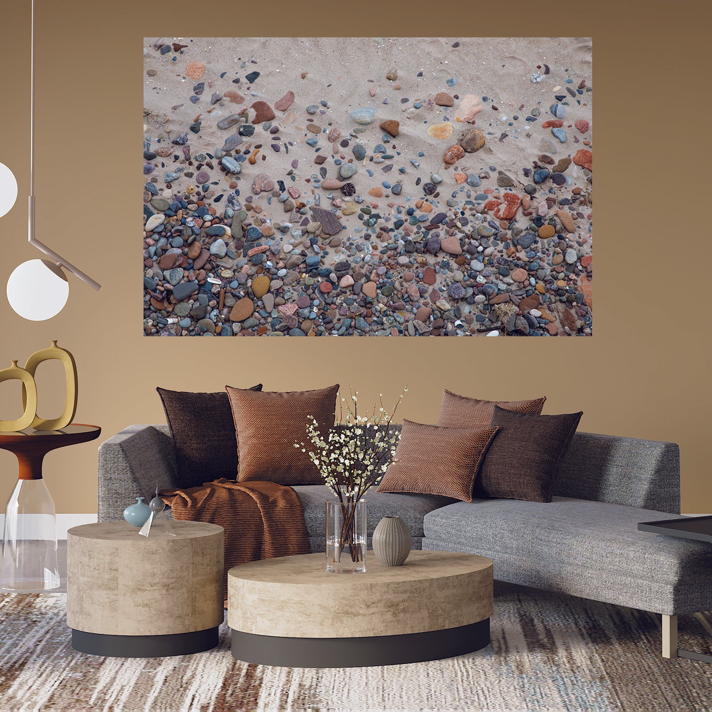 Casual living room with large wall art of Nairn Beach with colorful rocks in the sand by Lisa Blount Photography