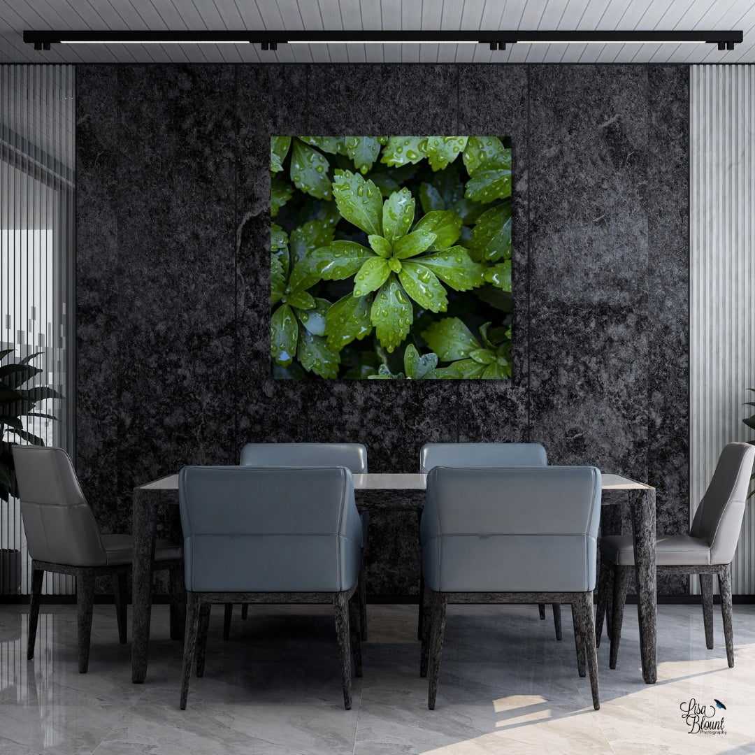 Large art of green leaves with raindrops on them hanging in modern grey conference or dining room