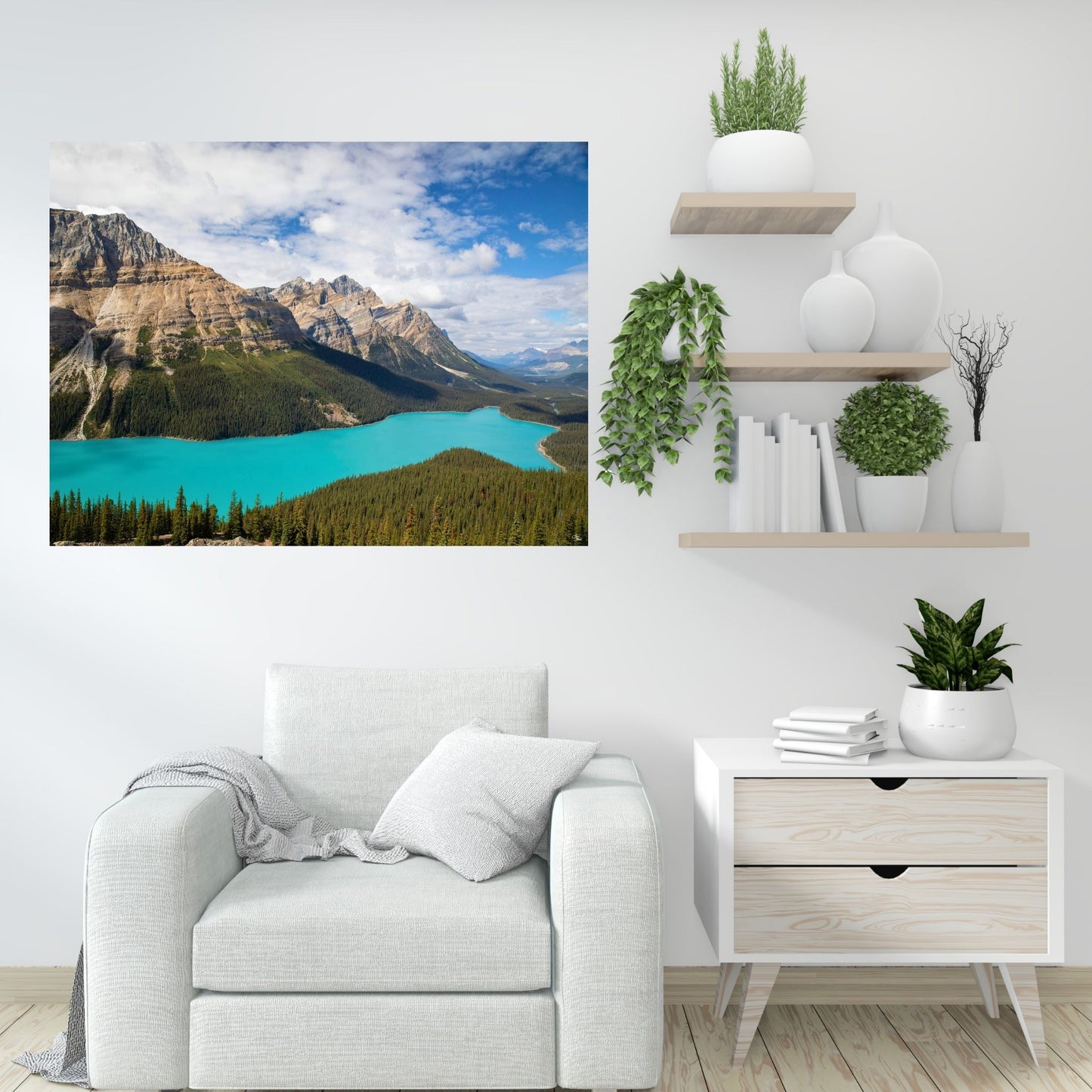 

A minimalist white room features a Peyto Lake fine art photo. The turquoise lake pops against neutral decor, complemented by greenery for a serene vibe.